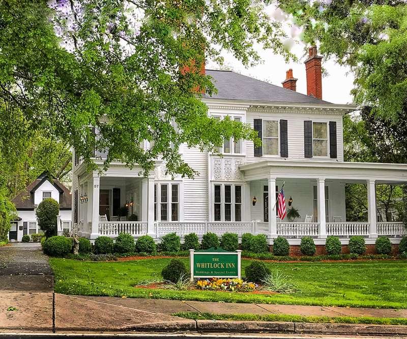 The Whitlock Inn Marietta. White house, green shutters, front porch